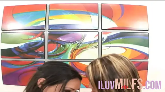 Two hot lesbians engaging in a passionate three-way encounter